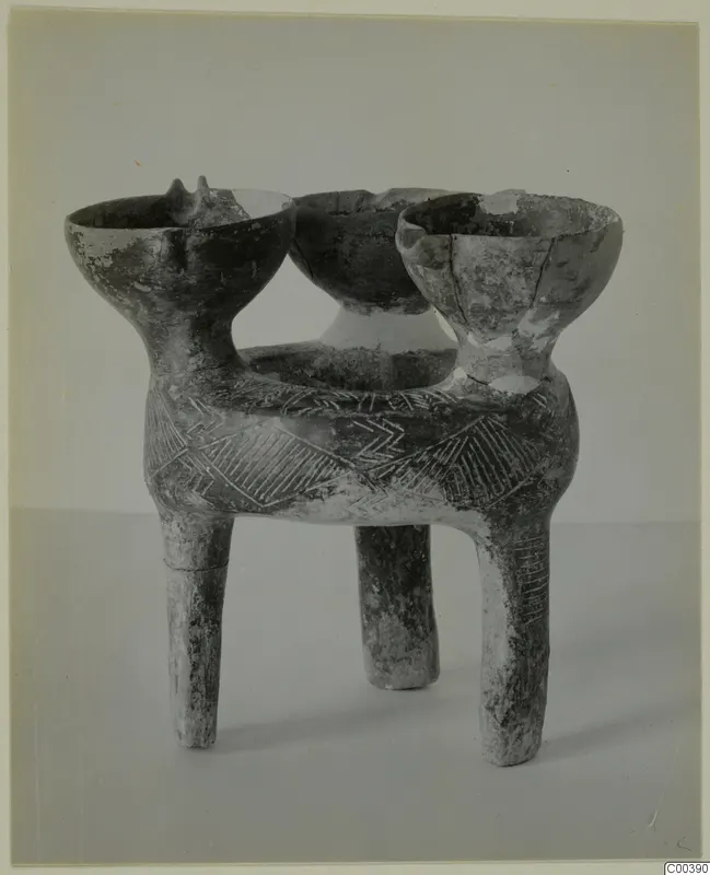 Tripod pottery vessel from Lapithos with three bowl-shaped mouths and incised chevron and hatched triangle decoration