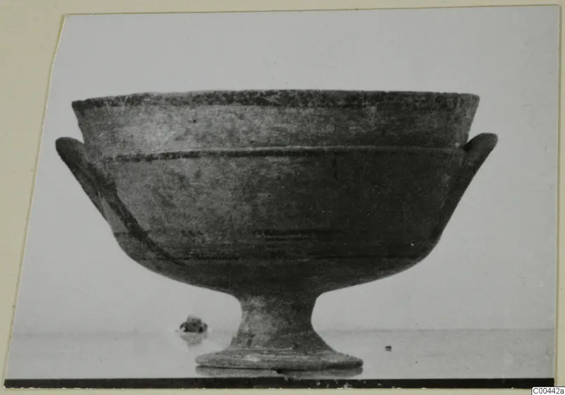 Pottery Black-on-Red I-III footed bowl with two side handles and dark painted bands, from Lapithos