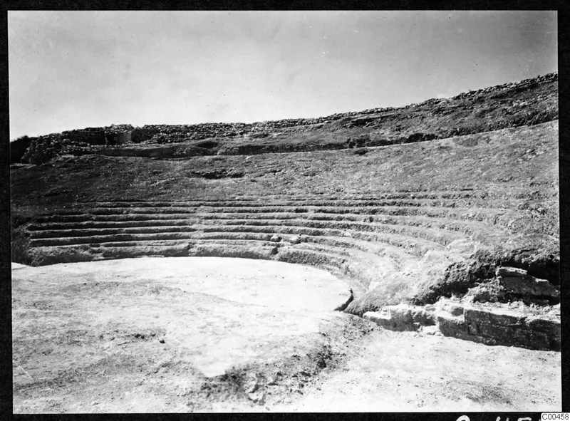 The theatre at Soli, with curved tiers of stone seating around an excavated circular orchestra.