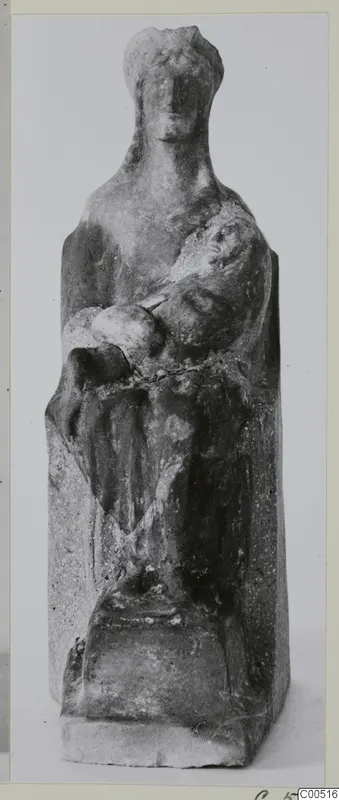 Seated figurine holding a small rounded object on its lap, from Vouni