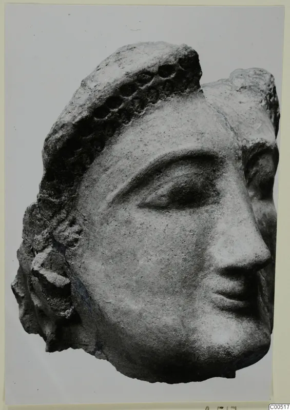 Terracotta head from Vouni, shown in three-quarter view with a dotted band across the hair