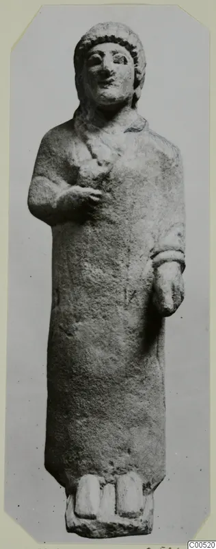 Limestone statue of a standing woman from Vouni, with one hand raised to the chest