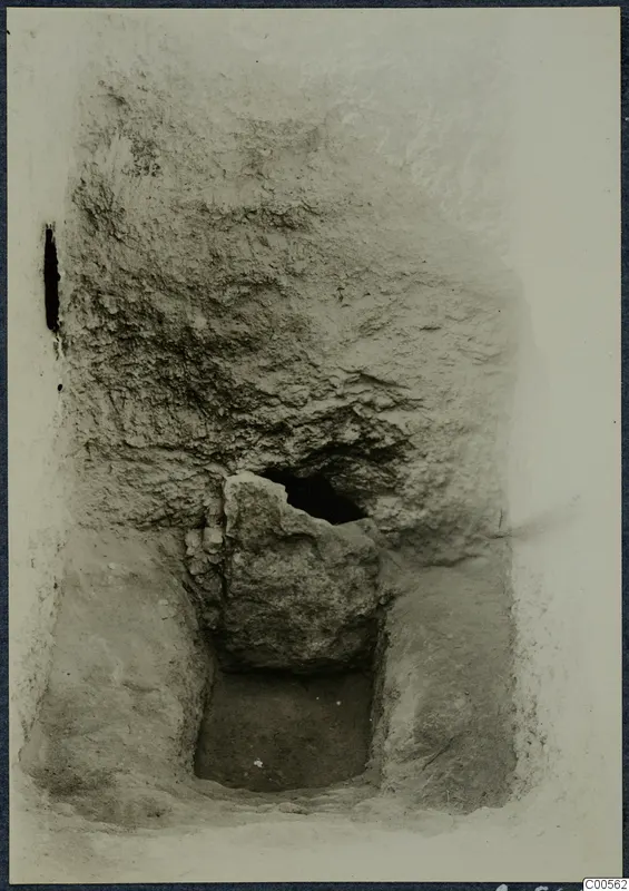 Excavated cutting at Vouni with a large stone block set against a vertical earth face