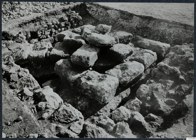 Large stone blocks lying in an excavation trench at Vouni