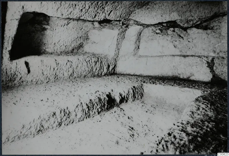 Rock-cut ledges and a recess in excavated stone at Vouni