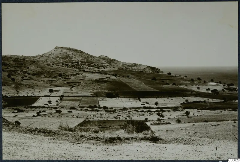 View from the acropolis of Soli across fields and hills toward the sea, with Vouni on the hill ridge
