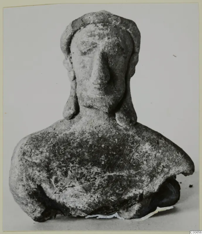 Terracotta bust figurine from Vouni with a close-fitting headdress and a large nose