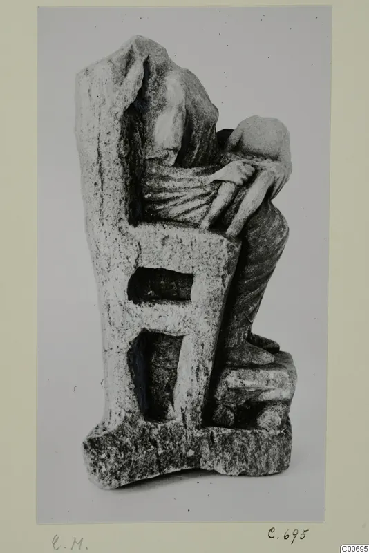 Limestone figurine of a seated figure with a small figure on its lap, from Vouni
