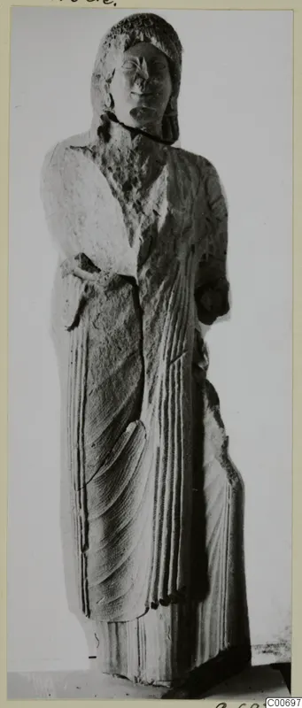 Limestone statue of a standing figure from Vouni, with hair framing the head and drapery falling in vertical folds