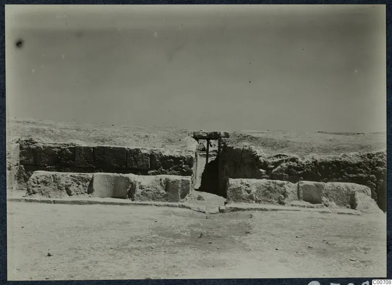 Theatre at Soli: stone wall with a gap spanned by a timber beam during excavation