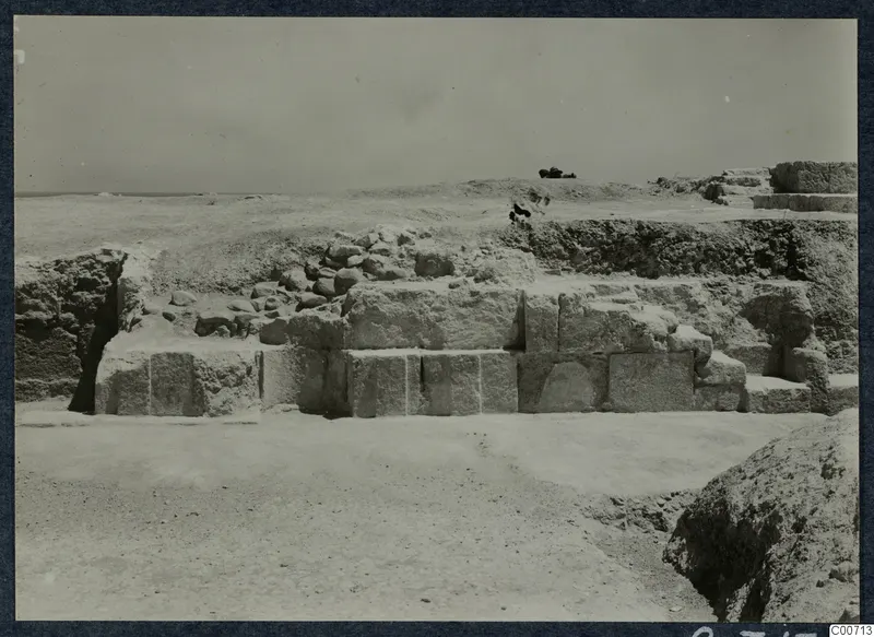 Squared stone blocks of the theatre at Soli during excavation, with loose rubble above them