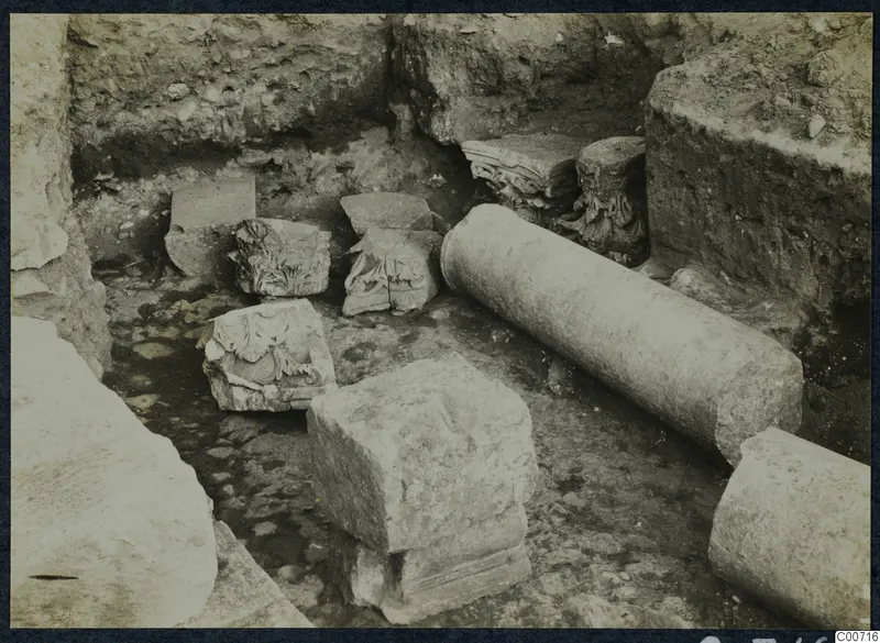 Excavated trench at Soli with carved stone capitals and column drums lying on the ground