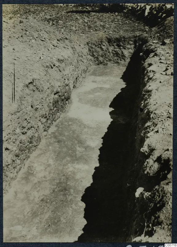Excavation trench at Soli with soil and stones along its sides