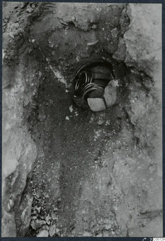 Gold treasure in situ in a small hollow in the ground in Room 59 at Vouni