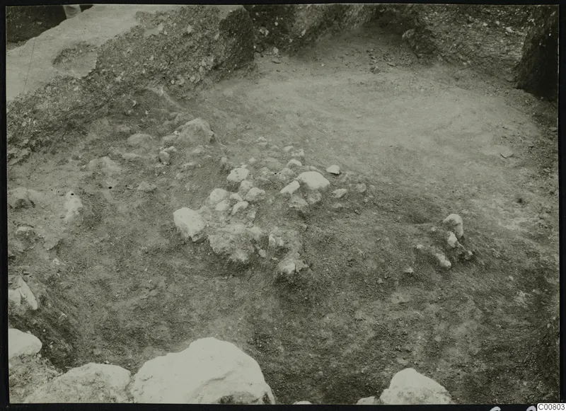 Excavation at Plakes, Lapithos, with scattered stones in the dug ground