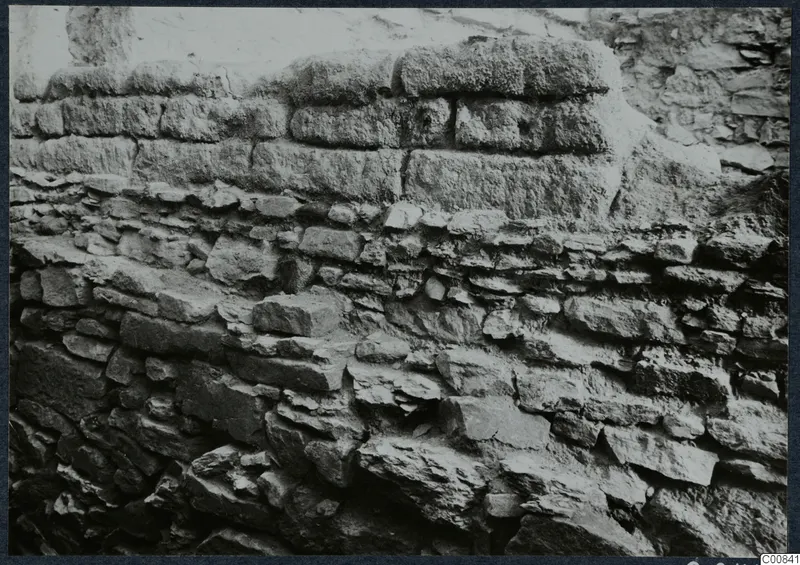Close view of a stone wall at Idalion Acropolis, with large upper blocks over smaller, irregular stones below.