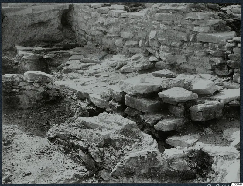 Excavated stone wall and fallen stone blocks at Idalion Acropolis