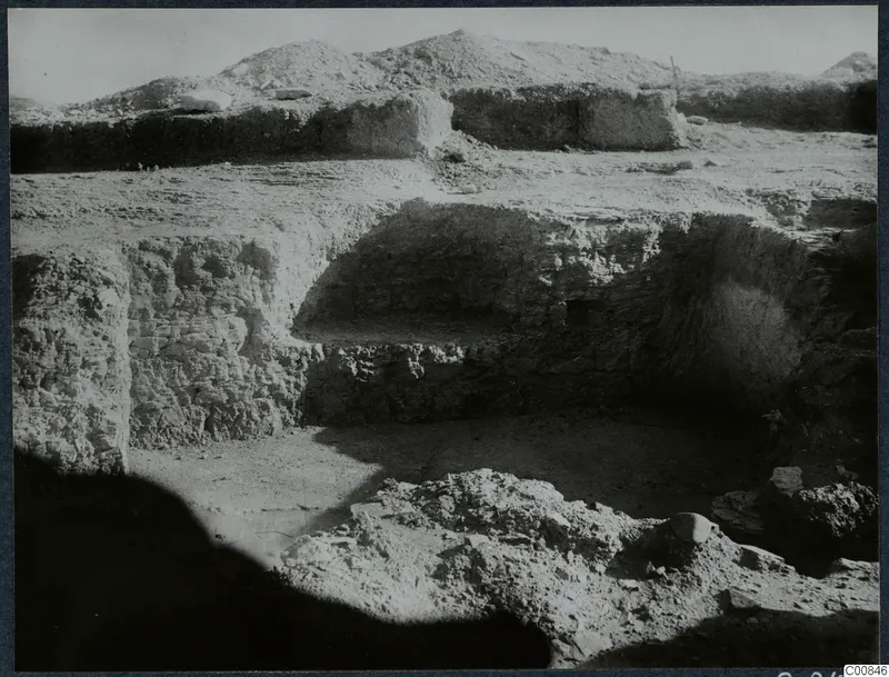 Excavation on the Acropolis at Idalion, with exposed walls and loose rubble in the trench