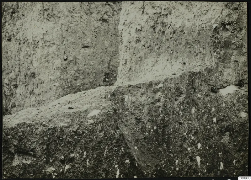 Excavated soil face at Plakes, Lapithos, with stones set in the earth