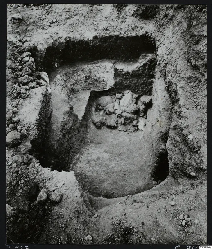 Tomb 427 at Lapithos during excavation, with loose stones in the tomb chamber