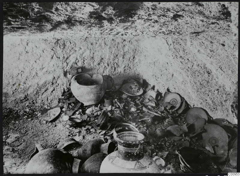 Tomb 428 at Lapithos Kastros: chamber interior with pottery and sherds lying in situ during excavation