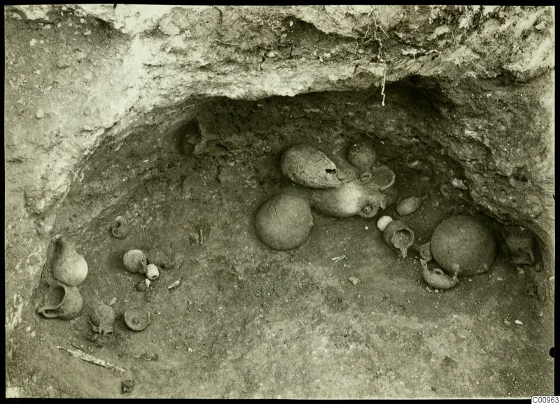 Excavated tomb chamber at Kylistra, Lapithos, with pottery vessels lying in situ
