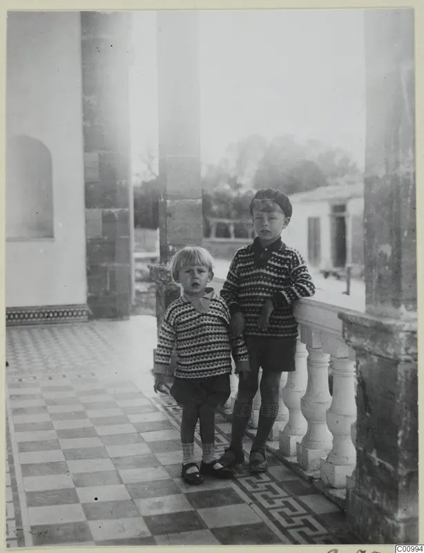 Stefan Gjerstad and Martin Gjerstad standing on a tiled veranda beside stone pillars, Nicosia.