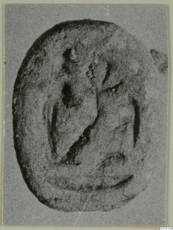 Oval scarab-shaped seal with a carved design on its flat face