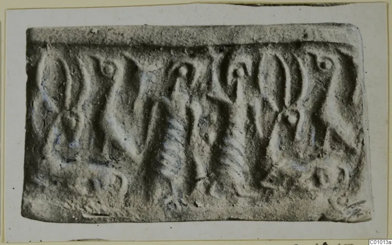 Rolled impression of a cylinder seal with carved figures and motifs in relief