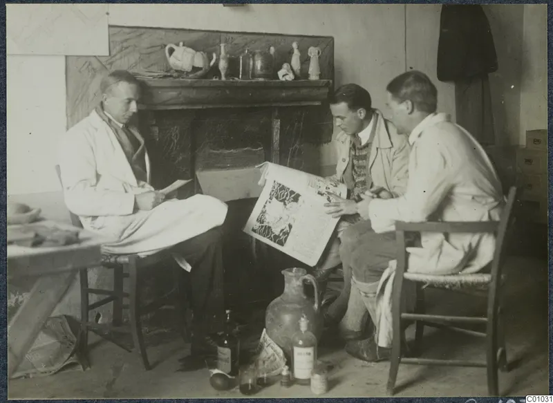 Three men seated in a room by a fireplace, one reading a newspaper, with bottles and a large jug on the floor.
