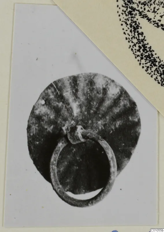 Bronze disc with radiating ridges and a loop attached at its lower edge, from Idalion