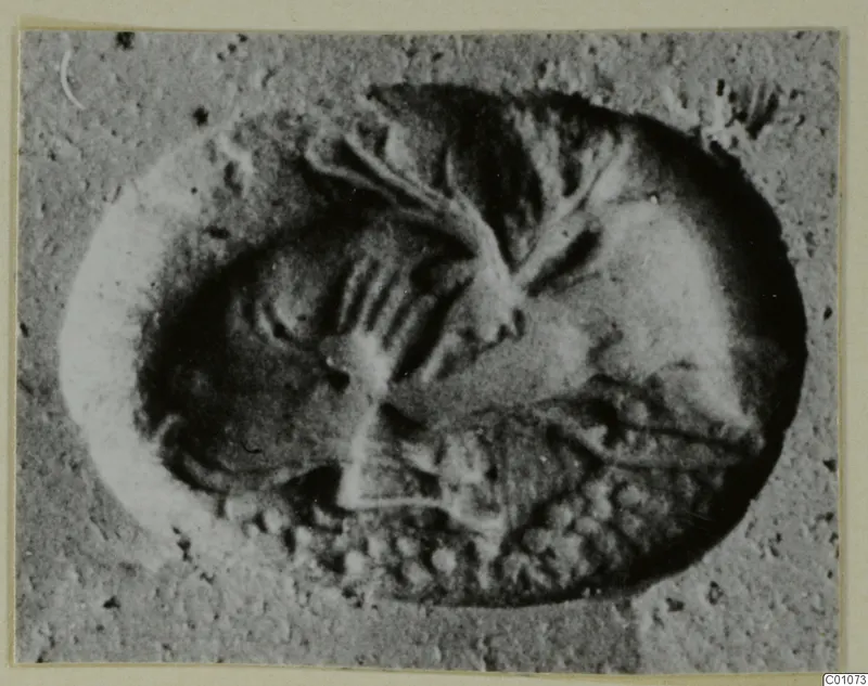 Impression of a cylinder or stamp seal showing a figure and marks, in grey tones.