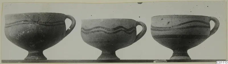 Three White Painted I bowls on pedestal bases, standing side by side with dark painted bands around their bodies