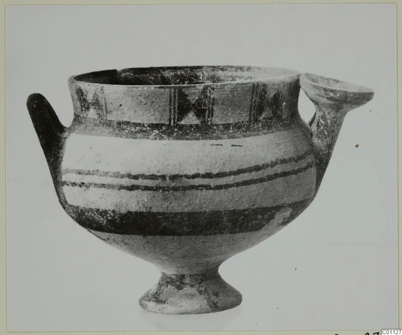 White Painted I bowl with two handles and dark painted bands, shown against a pale background
