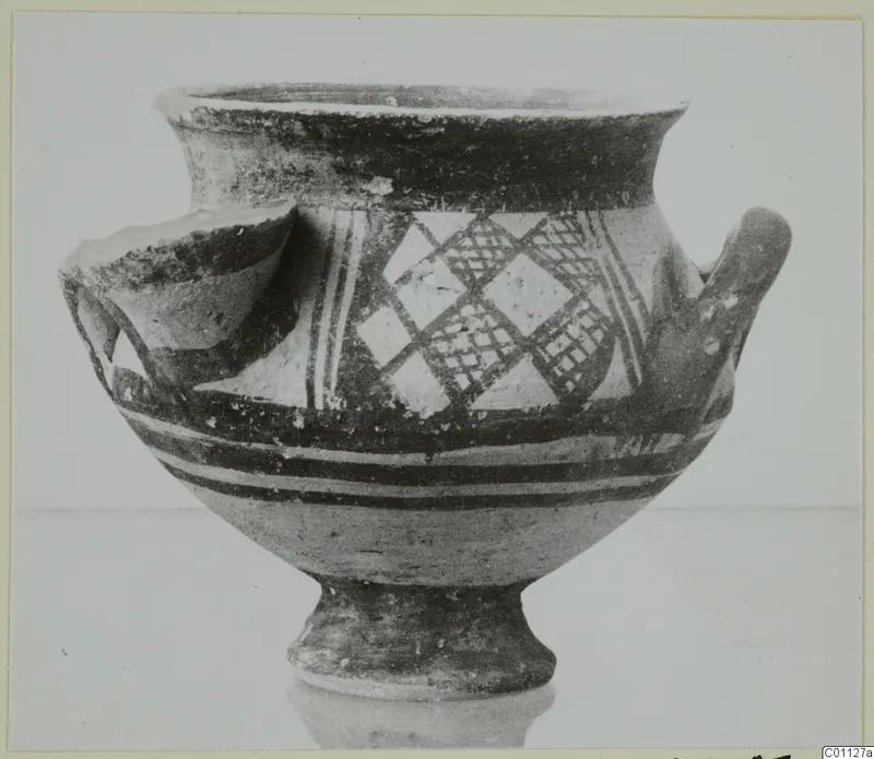 White Painted I bowl with dark painted bands and diamond lattice panels, shown on a pale surface