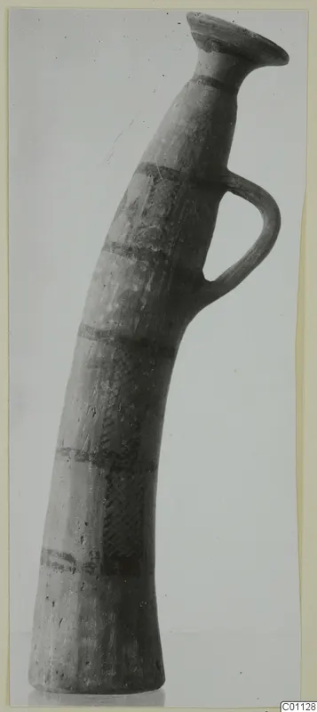 Horn-shaped White Painted II pottery vessel with a flared rim and single loop handle, from the Kastros tombs at Lapithos.