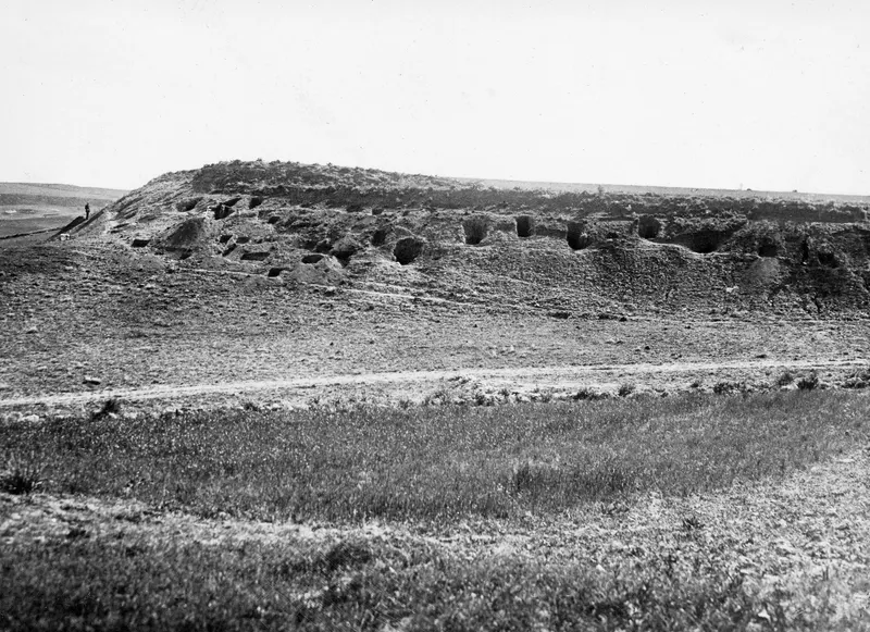 First burial ground at Sikarka-Kokkina, Marion: a hillside with a row of cut tomb openings in its eroded face