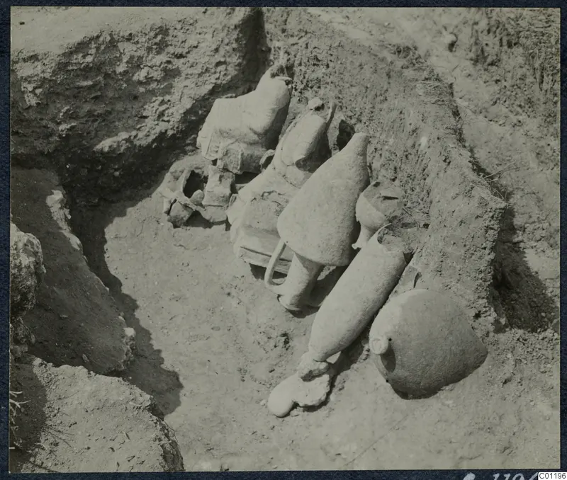 Pottery vessels lying in situ in the excavation of Tomb 30 at Marion, seen from above