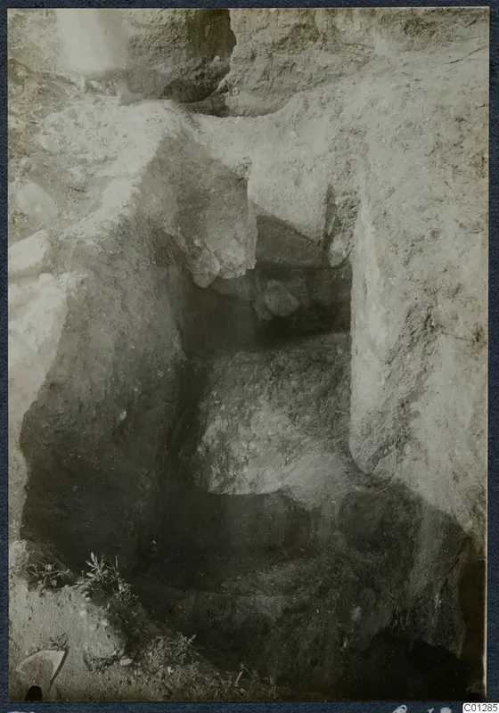 Tomb 47 at Marion during excavation, showing a cut passage and chamber opening in soil