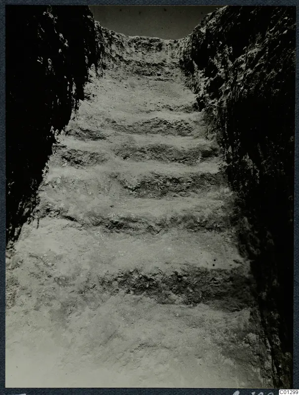 Dromos of Tomb 60 at Marion, a stepped passage cut down between rock faces during excavation.