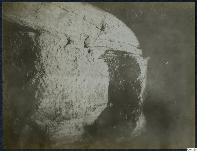 Large rough-surfaced stone block with an overhanging ledge, from an excavation on the Karpas peninsula