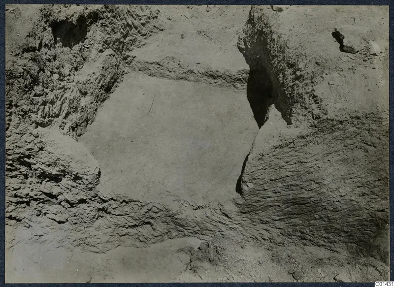 Close view of excavated earth at T.96, Marion, with rough walls and a flat floor in the centre