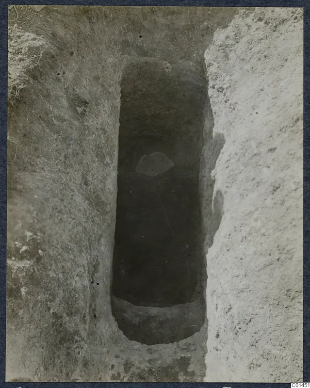 Tomb 11 at Ayios Iakovos, narrow excavated tomb chamber cut into soil