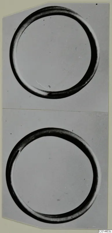 Two photographs of a plain circular hair-ring, one above the other on a card