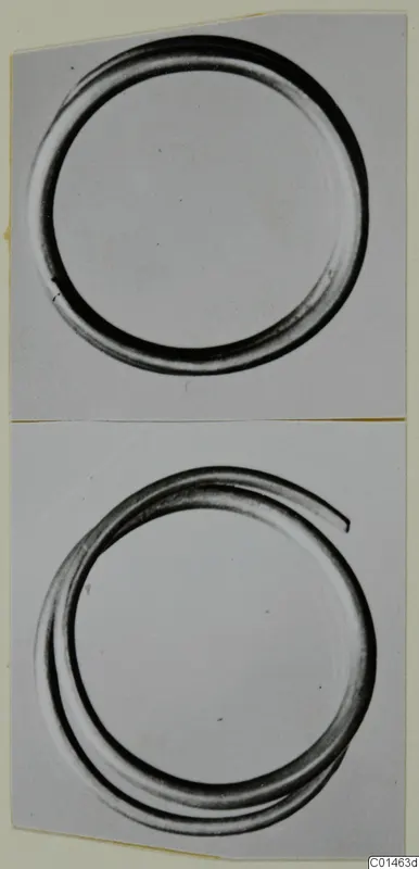 Two photographic views of metal rings, one a closed circle and one with overlapping coils
