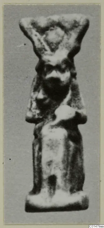 Small standing figurine with a broad headdress, folded arms and a bearded face, from the Marion finds