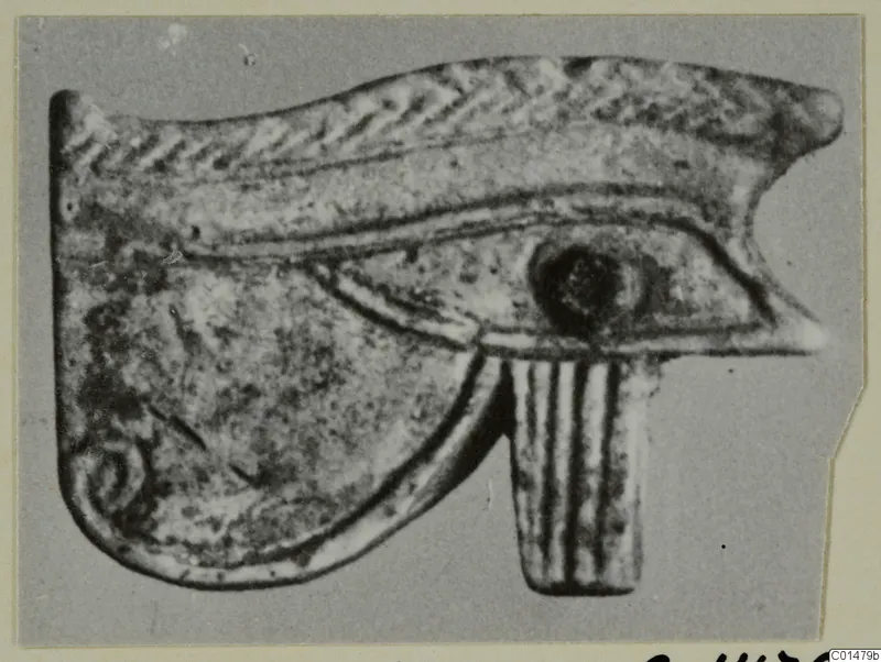 Eye-shaped amulet with a ribbed lower tab, from Marion Tomb 50