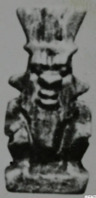 Small standing figure with a tall flared headdress and arms at its sides, from Marion Tomb 50