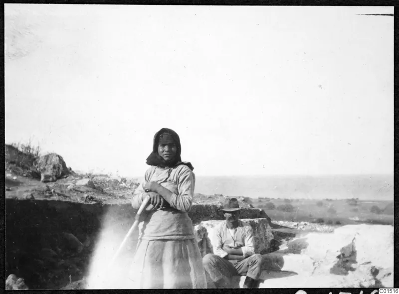 A girl and a man at the excavation of the theatre at Soli