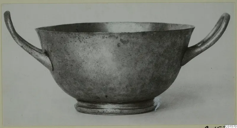 Two-handled silver cup from Vouni, shown in side view against a plain background